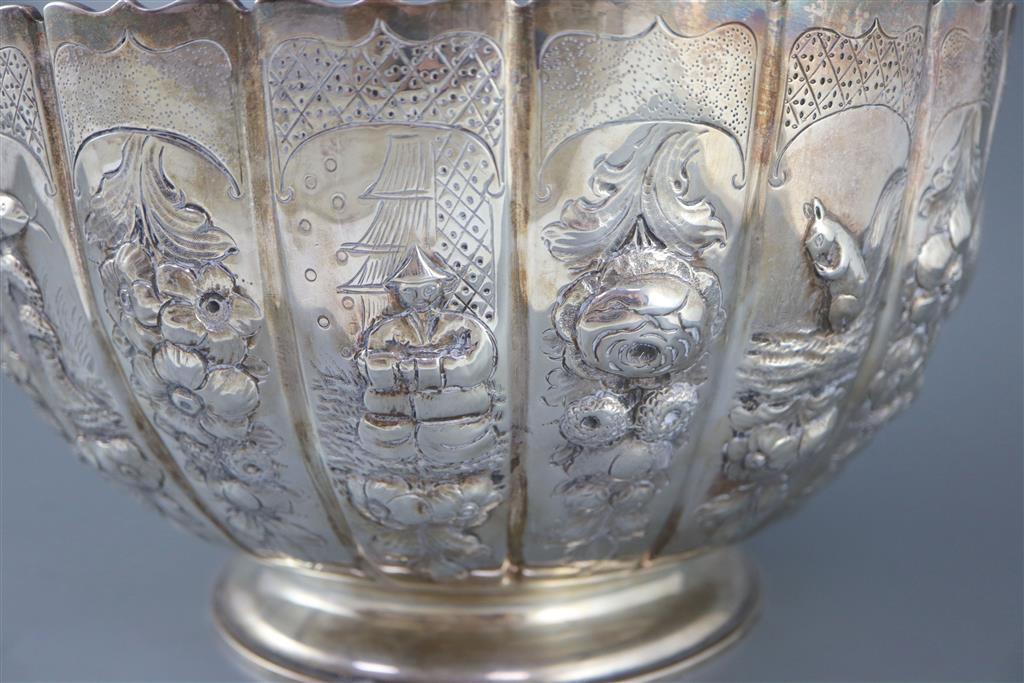 A late Victorian embossed silver presentation punch bowl, by Thomas of New Bond Street, London, 1890,